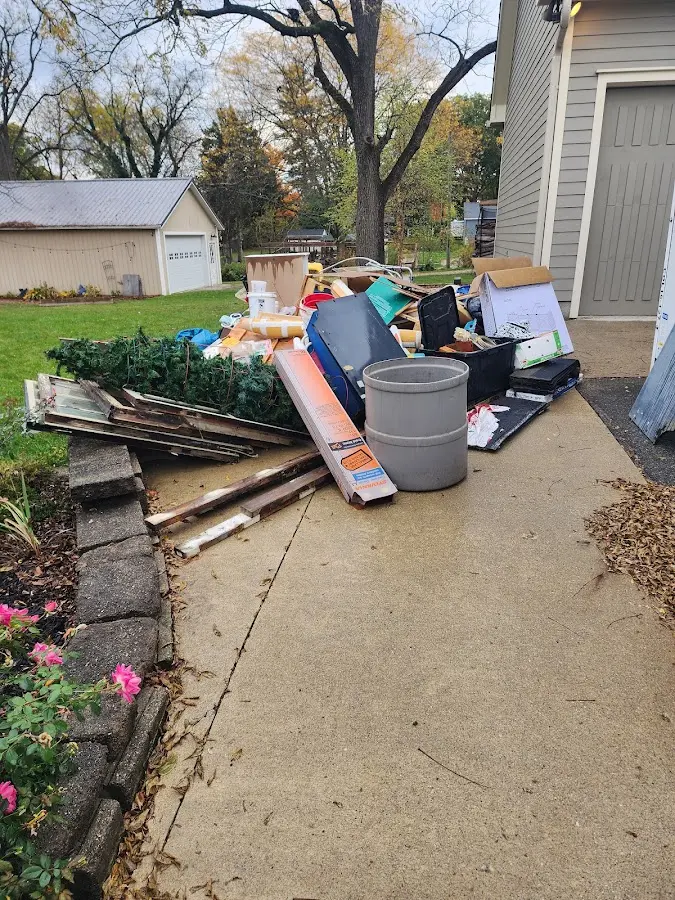 Dumpster being loaded with debris for Residential Dumpster Rental in Luverne
